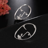 Hollow Out Face Dangle Earrings