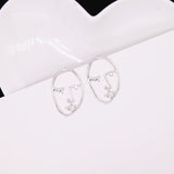 Hollow Out Face Dangle Earrings